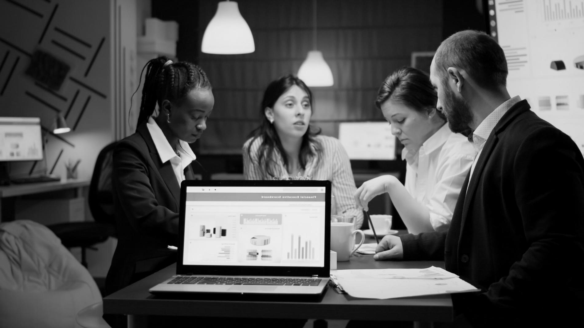 Comprehensive study materials and financial planning resources spread across a workspace with analysis tools and calculators