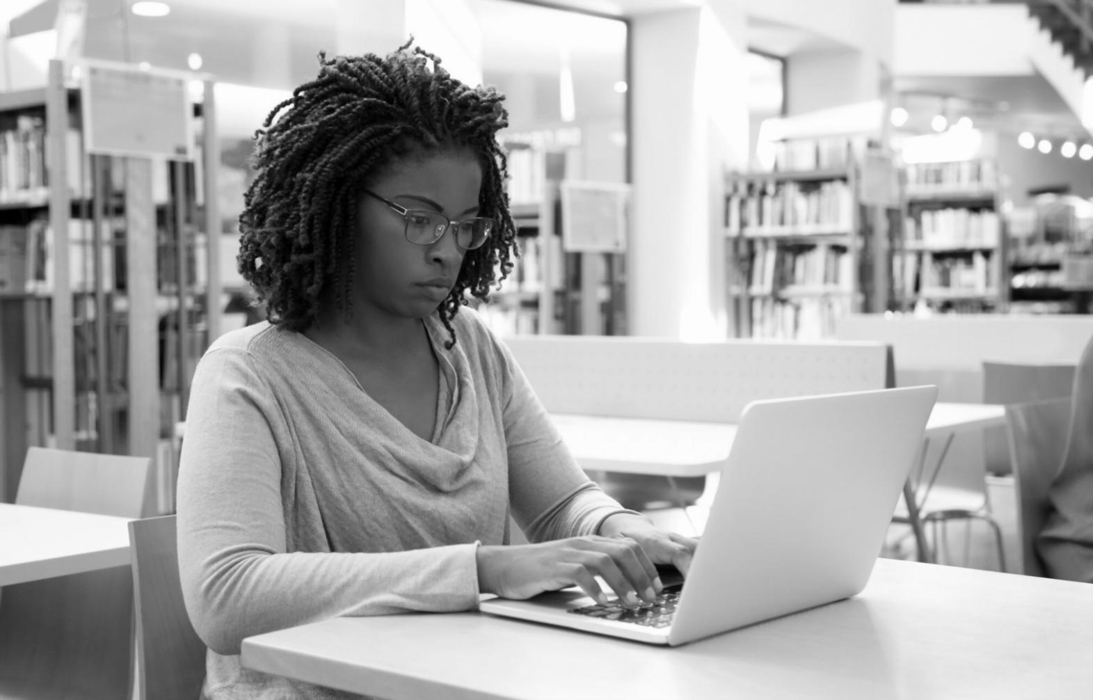 Students engaged in practical inflation education workshop discussing real-world financial scenarios